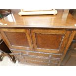 EARLY 20TH CENTURY OAK FRAMED LOWBOY TYPE CABINET WITH TWO PANELLED DOORS OVER THREE FULL WIDTH