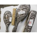 THREE SILVER BACKED CLOTHES BRUSHES