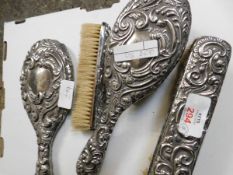 THREE SILVER BACKED CLOTHES BRUSHES