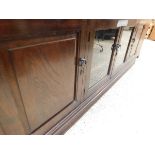 LARGE HEAVY OAK SIDEBOARD WITH TWO GLAZED DOORS