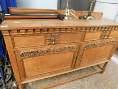 OAK FRAMED SIDEBOARD FITTED WITH TWO DRAWERS OVER TWO PANELLED CUPBOARD DOORS ON BARLEY TWIST LEGS