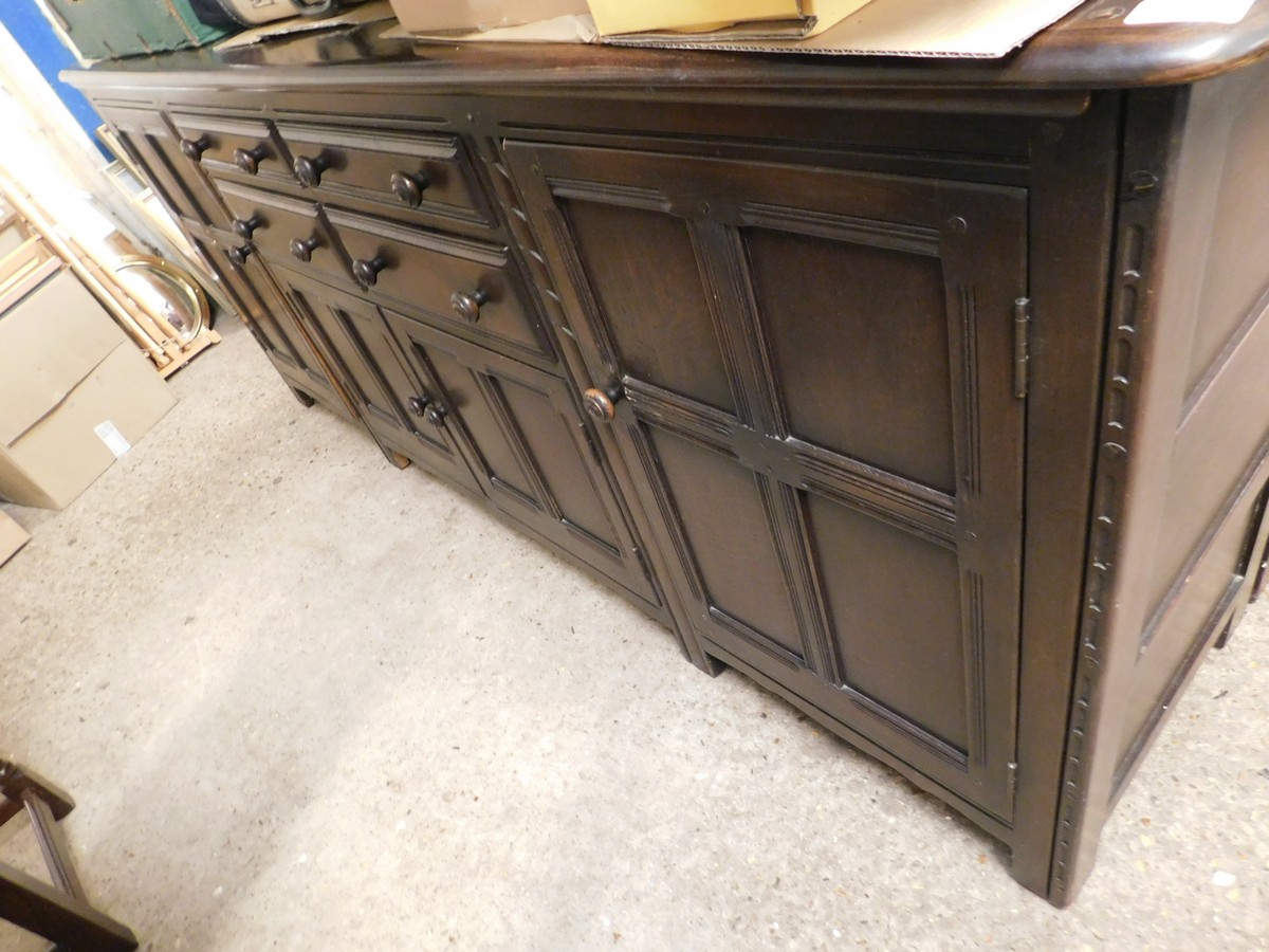 GOOD QUALITY LARGE ERCOL DRESSER FITTED CENTRALLY WITH FOUR DRAWERS OVER TWO CUPBOARD DOORS