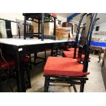 ORIENTAL EBONISED DINING TABLE AND A SET OF EIGHT CHAIRS WITH SHAPED SPLAT BACKS AND RED UPHOLSTERY,