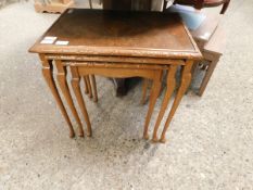 WALNUT NEST OF THREE TABLES WITH GLASS TOPS