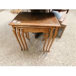 WALNUT NEST OF THREE TABLES WITH GLASS TOPS