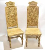 Pair of mahogany framed painted hall chairs with carved shield armorial back with crown top with