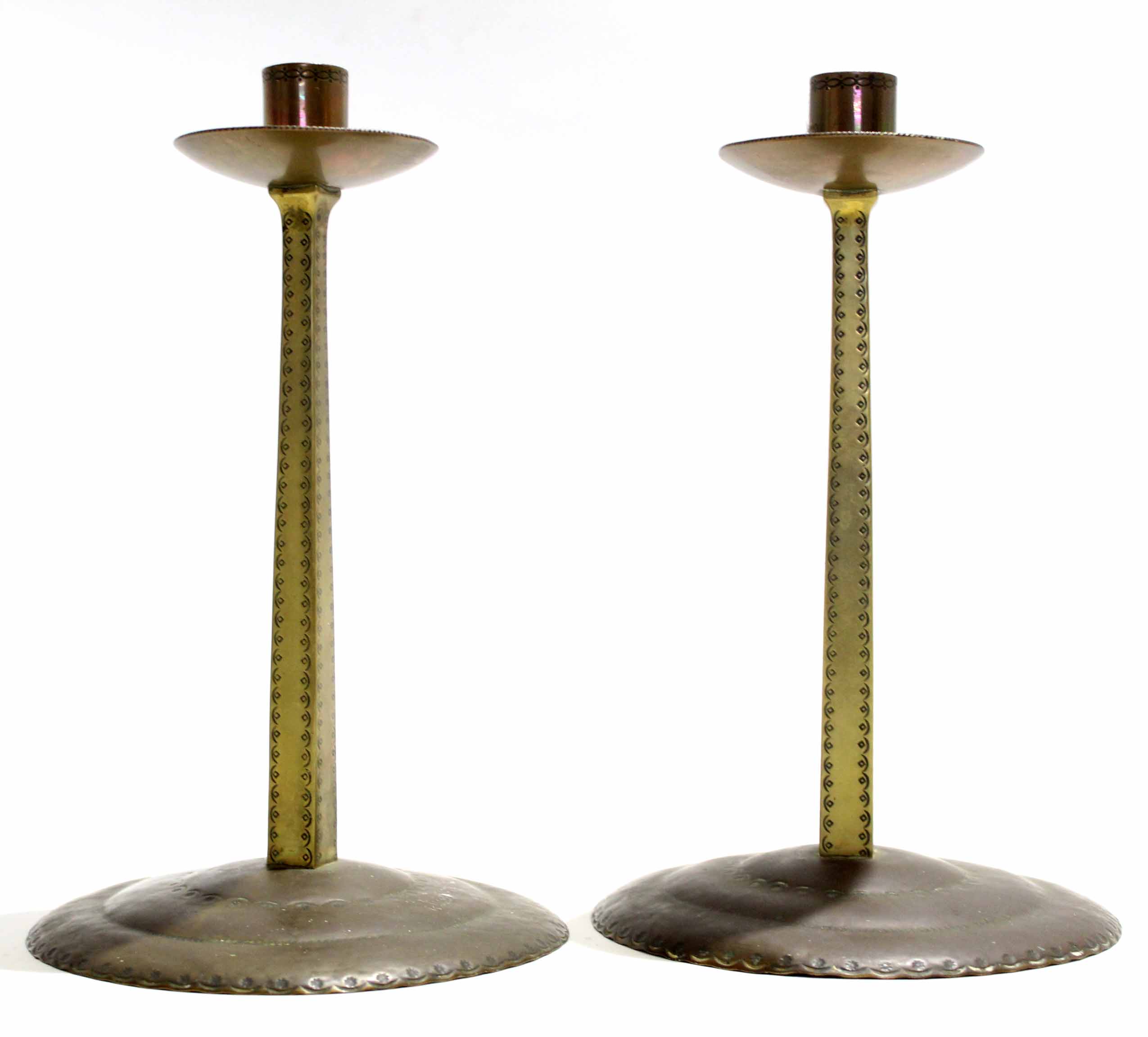 Russell & Sons pair of Arts & Crafts "Lygon" brass candlesticks, possibly manufactured in the