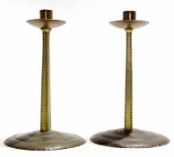 Russell & Sons pair of Arts & Crafts "Lygon" brass candlesticks, possibly manufactured in the