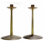 Russell & Sons pair of Arts & Crafts "Lygon" brass candlesticks, possibly manufactured in the