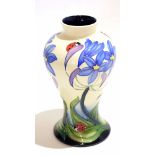 Modern Moorcroft vase dated 2005 with the incised design of flowers and ladybirds, 21cm high