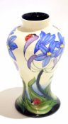 Modern Moorcroft vase dated 2005 with the incised design of flowers and ladybirds, 21cm high