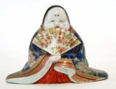 Oriental model of a lady holding a fan decorated in polychrome enamels, 10cm high