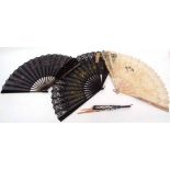Group of four fans with wooden sticks and floral decoration on lace