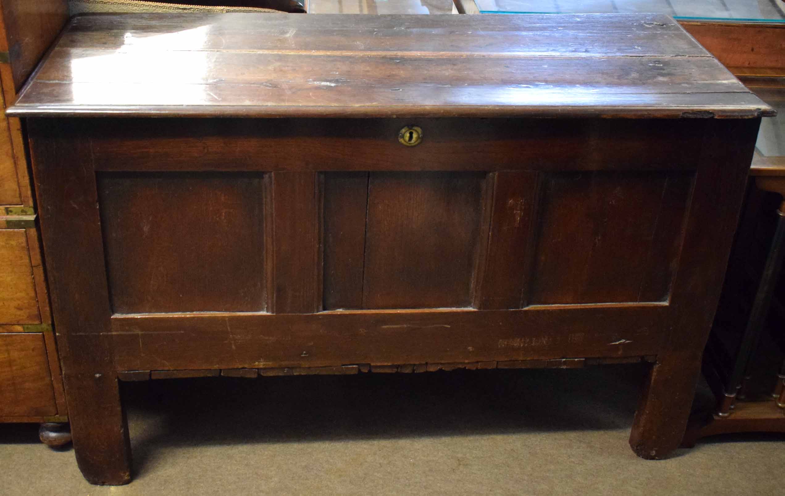 Late 17th/early 18th century and later oak coffer, plain top and three panelled front raised on