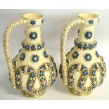 Pair of Hungarian late 19th century ewers with an applied swirling reticulated design in blue and