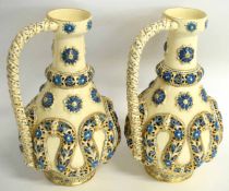 Pair of Hungarian late 19th century ewers with an applied swirling reticulated design in blue and