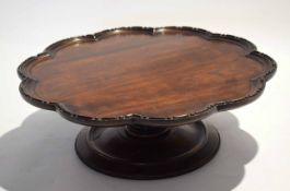 Mahogany lazy susan of hipped circular form raised on a typical spreading circular base, circa early