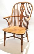 Early 18th century elm and yew wood stock back chair with open splat with wheel design and elm seat,