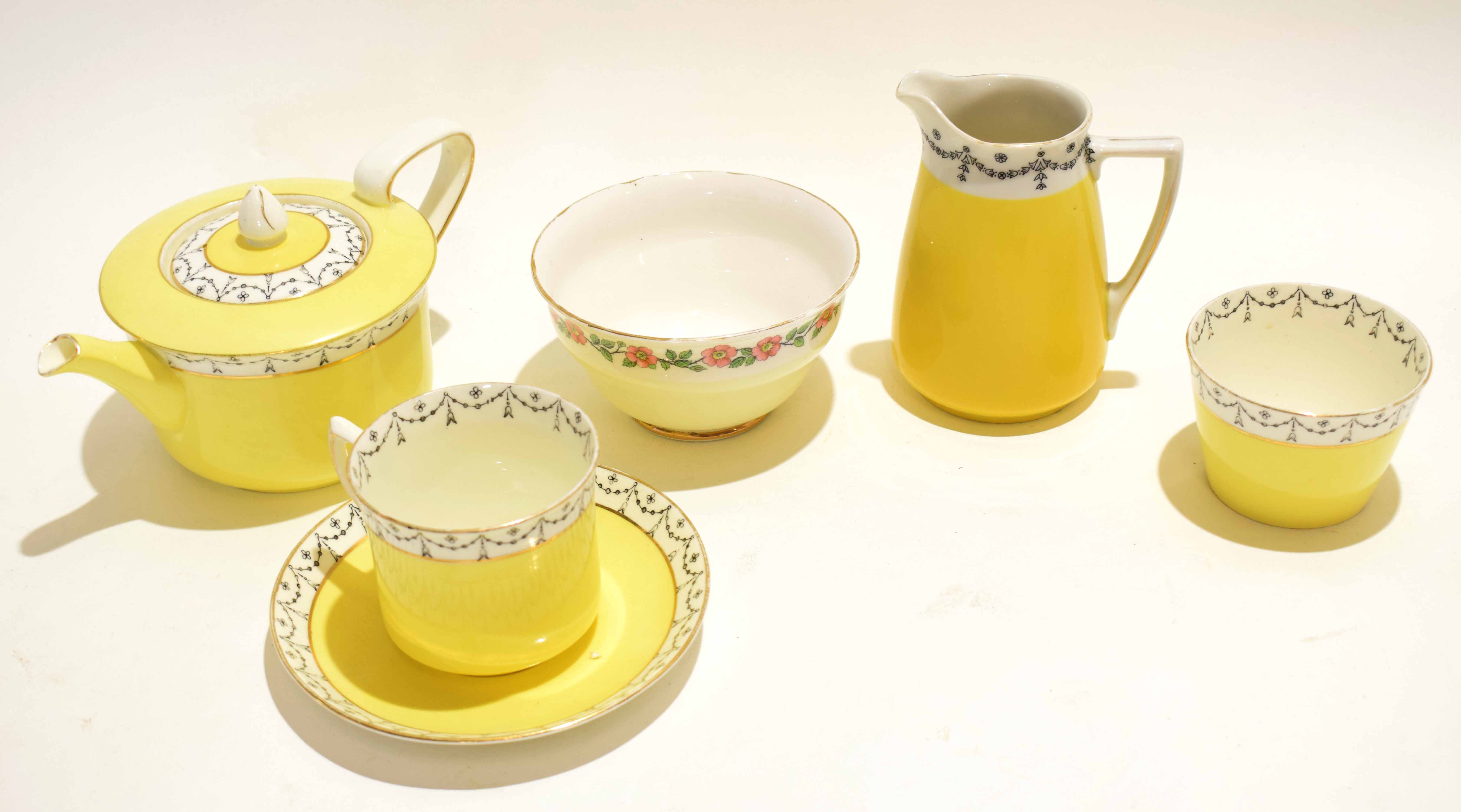 Part tea service by Grimwade comprising tea pot and sugar bowl, jug and a further beaker and tea cup
