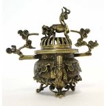 Chinese bronze effect censer and cover, the cover with a dragon type knop, and scroll leaf effect