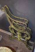 Weathered cast metal garden bench frame comprising two ends, each 84cm high