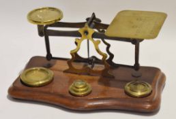 Set of late 19th/early 20th century mahogany based postal scales, together with weights, 24cm long