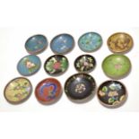 Group of 12 cloisonne small dishes all decorated in typical fashion with either floral designs or