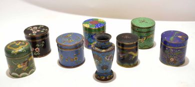 Group of seven cloisonne cylindrical boxes and covers with typical enamel decoration, together