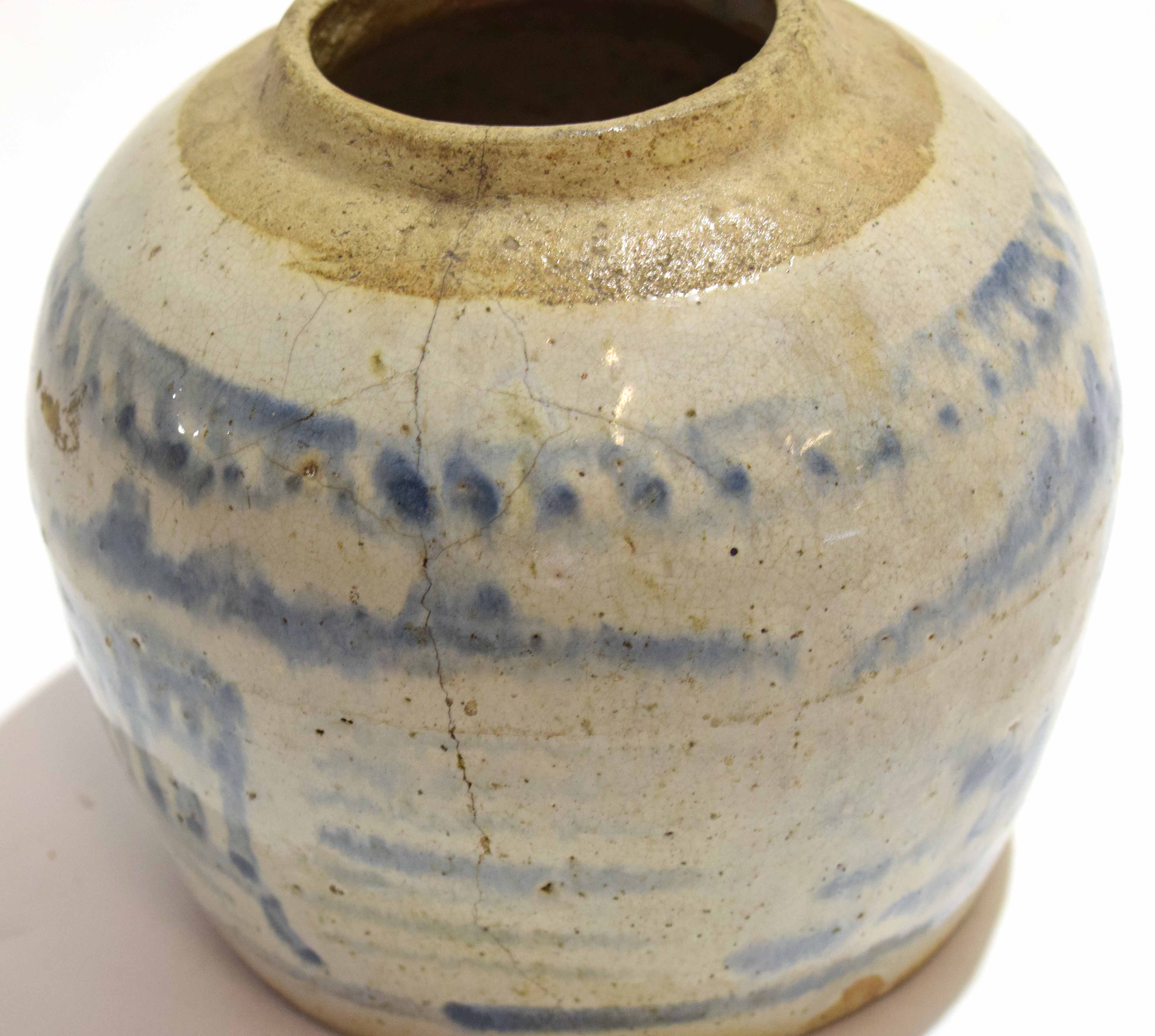 Oriental pottery jar decorated in a blue and white provincial style, 17cm high - Image 3 of 5