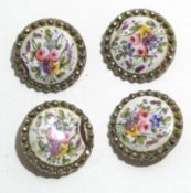 Group of four late 19th century gilt buttons, the centres with enamel decoration painted with floral