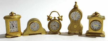 Group of small brass clocks modelled as ships steering and other mantel clocks (qty)