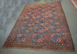 Good quality Afghan rug with brown field with repeating lozenge centre and multi-gull border,