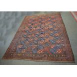 Good quality Afghan rug with brown field with repeating lozenge centre and multi-gull border,