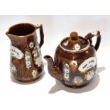 Barge ware type tea pot, the chocolate glaze with typical applied designs and the name Mrs Monk 1883