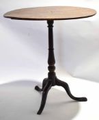 Mahogany oval pedestal table raised on ring turned support with tripod base, 61.5cm wide