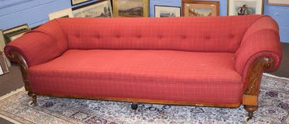 Mid-Victorian Chesterfield style large sofa, the carved oak arms joined by a plain frieze and with