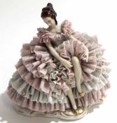 Continental porcelain model of a lady in flounced dress on lobed base with factory blue Dresden mark