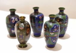 Group of cloisonne vases, Meiji period, decorated in typical fashion, one pair with a lobed shape