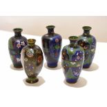 Group of cloisonne vases, Meiji period, decorated in typical fashion, one pair with a lobed shape