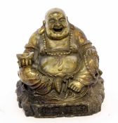 Oriental metal model of a laughing Buddha with Chinese script to base, 11cm high