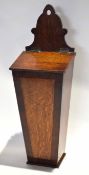 19th century oak and mahogany banded wall mounted candle box of tapering form with hinged lid,