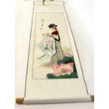 Oriental scroll watercolour of a lady in garden setting surrounded by lilies with black