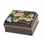 Cloisonne box and cover, the scroll ground decorated with a floral design, 9cm diam