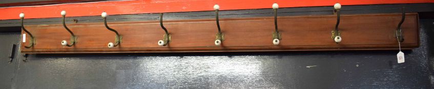 Large late 19th/early 20th century rectangular coat/hat rack fitted with brass plated hooks and