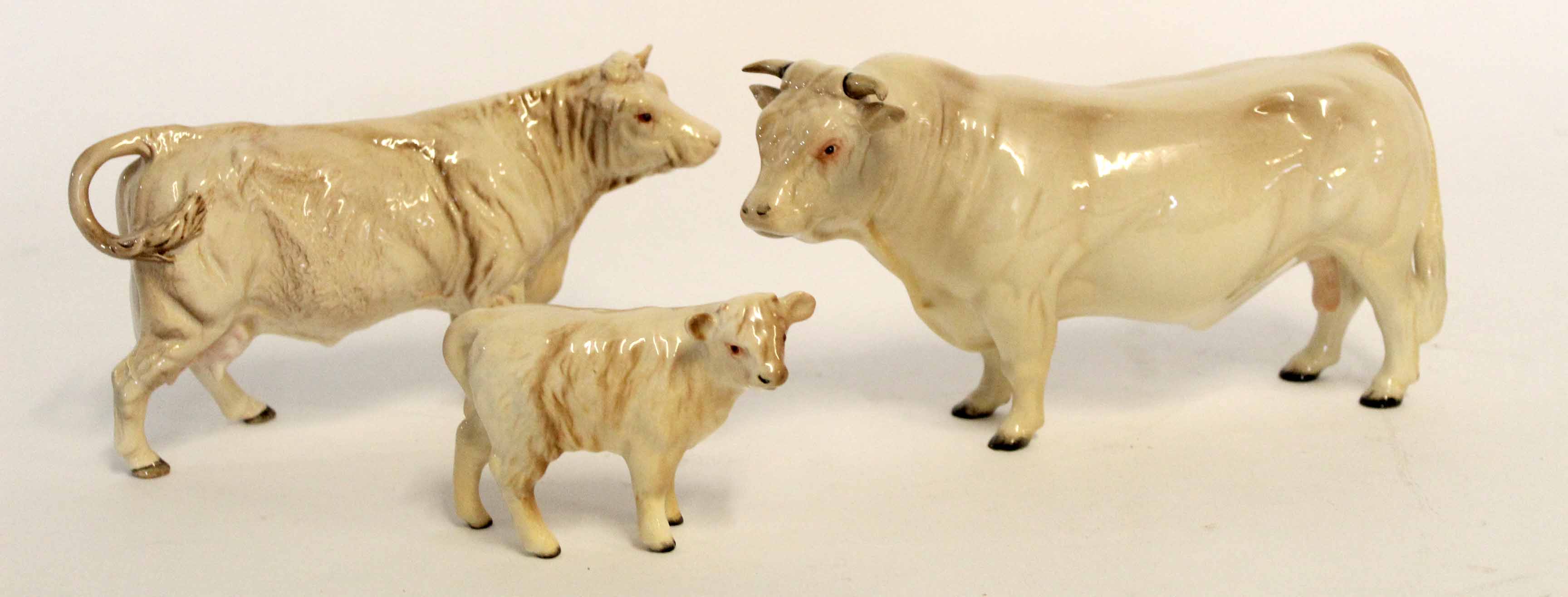 Collection of John Beswick figures comprising a bull, cow and calf (3)