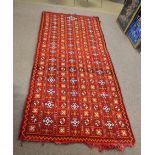 Good quality modern carpet predominantly in red, orange and cream with repeating geometric lozenge