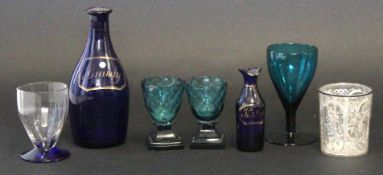 Collection of sundry glass ware including two green glass wine glasses on black shaped feet and a