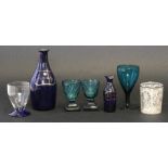 Collection of sundry glass ware including two green glass wine glasses on black shaped feet and a