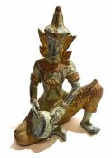 Oriental figure of a Hindu deity playing a tambourine with gilt highlights, 15cm high