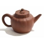 Yixing type red ware tea pot and cover, the cover with a dog of Fo finial and signature block to